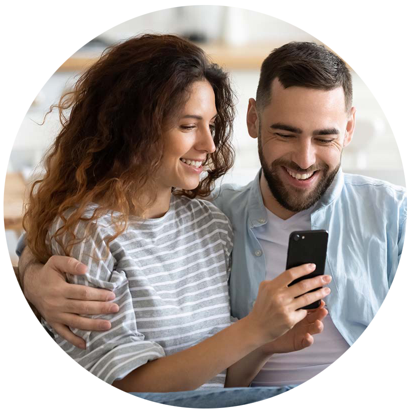 Couple using a smartphone to view their online home inspection report